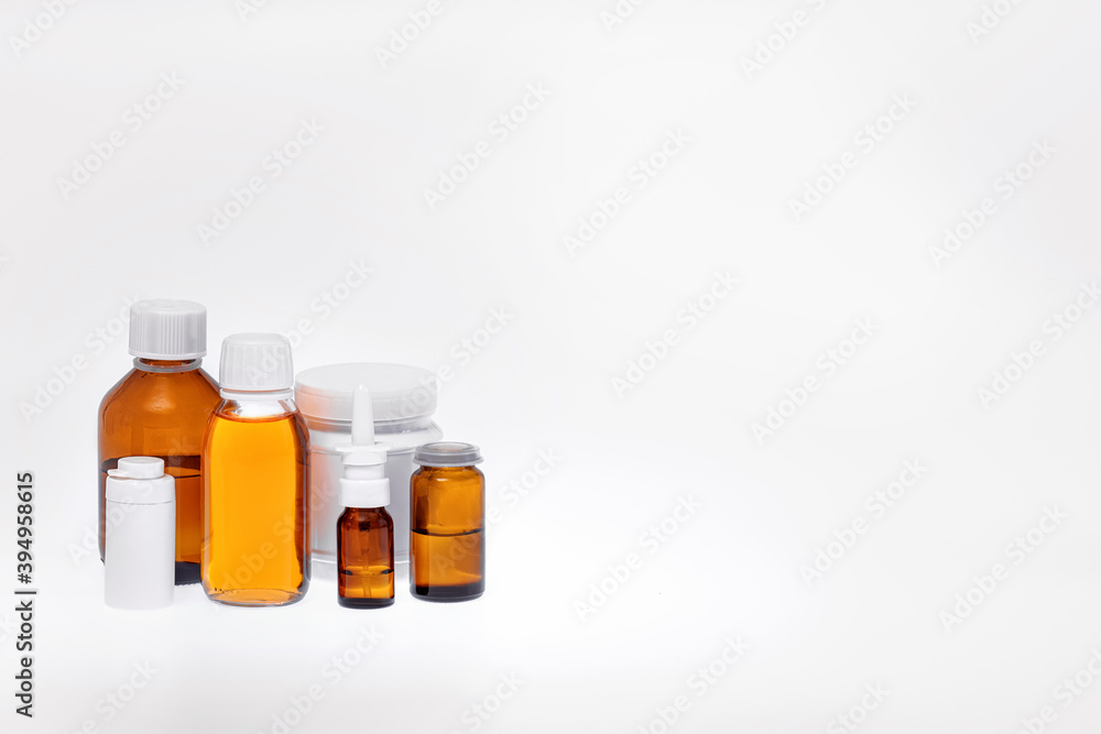 medicines in different jars, containers, tubes, syrups, tinctures, oils and sprays. Concept of pharmacy, laboratory, home first aid kit, isolate on a white background. free space, space for text medicines in different jars, containers, tubes, syrups, tinctures, oils and sprays. Concept of pharmacy, laboratory, home first aid kit, isolate on a white background. free space, space for text