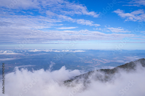 Fototapeta Naklejka Na Ścianę i Meble -  Beautiful scenic view of mountains and clouds against the sky in Kew Mae Pan nature trail at Doi Inthanon, Chiang Mai, Thailand. Famous tourist attractions of Thailand. Concept of holiday and travel