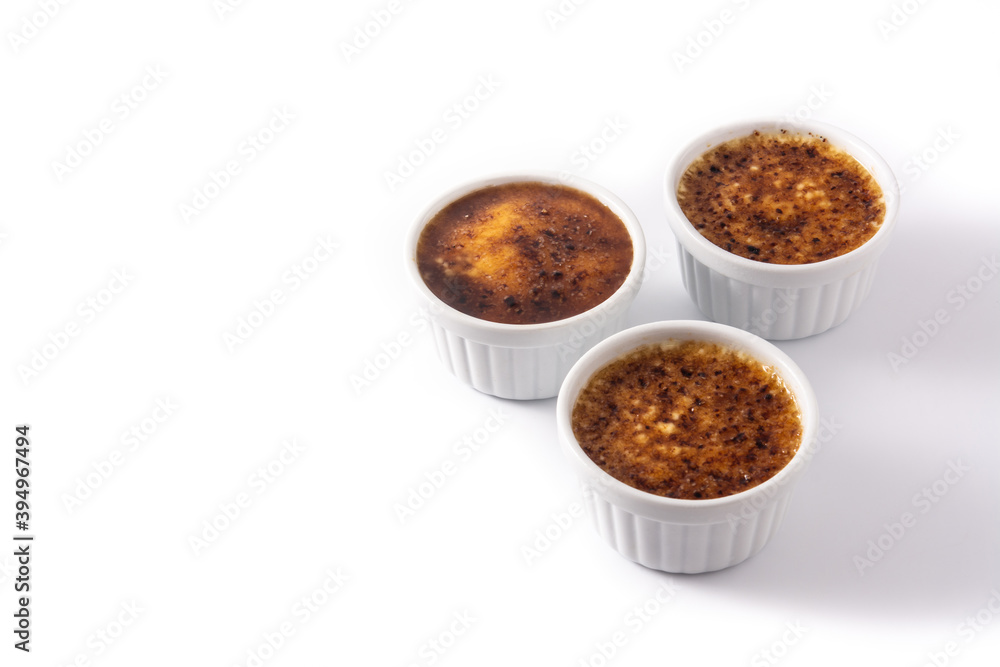 Homemade creme brulee in bowl isolated on white background.Copy space Homemade creme brulee in bowl isolated on white background.Copy space
