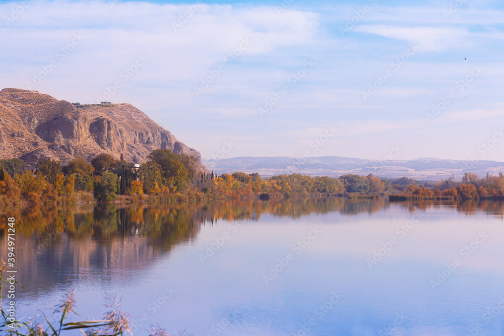 Calm lake in a mountainous autumn landscape