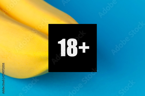 Two bananas as a symbol of a bare female breast with censorship 18+. Naked fruit boobs, erotic food.
