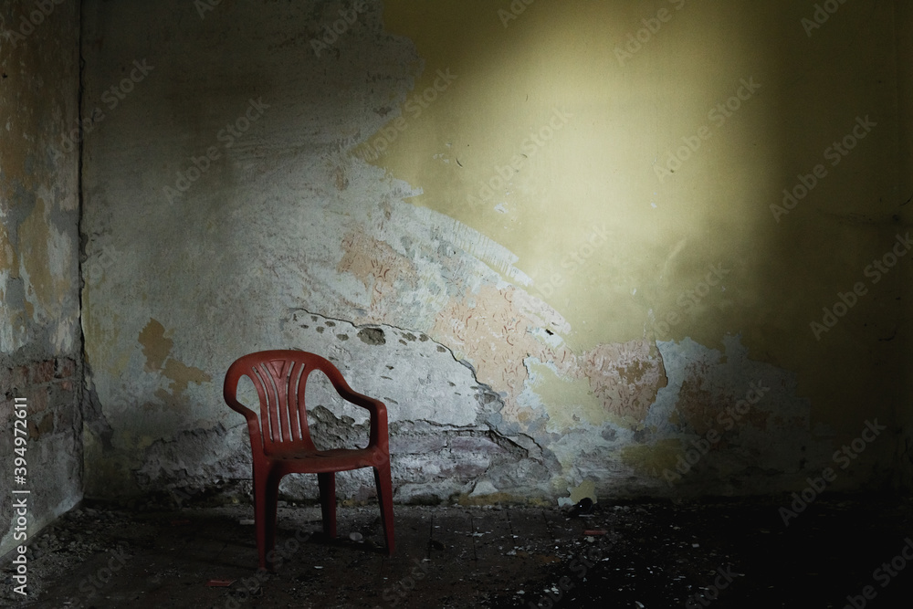 Lost chair in a lost place. Red broken walls decay destroyed dirt ...