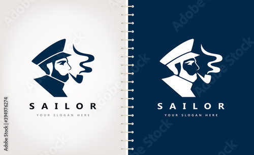 Sailor captain in a peaked cap smoking a pipe logo vector