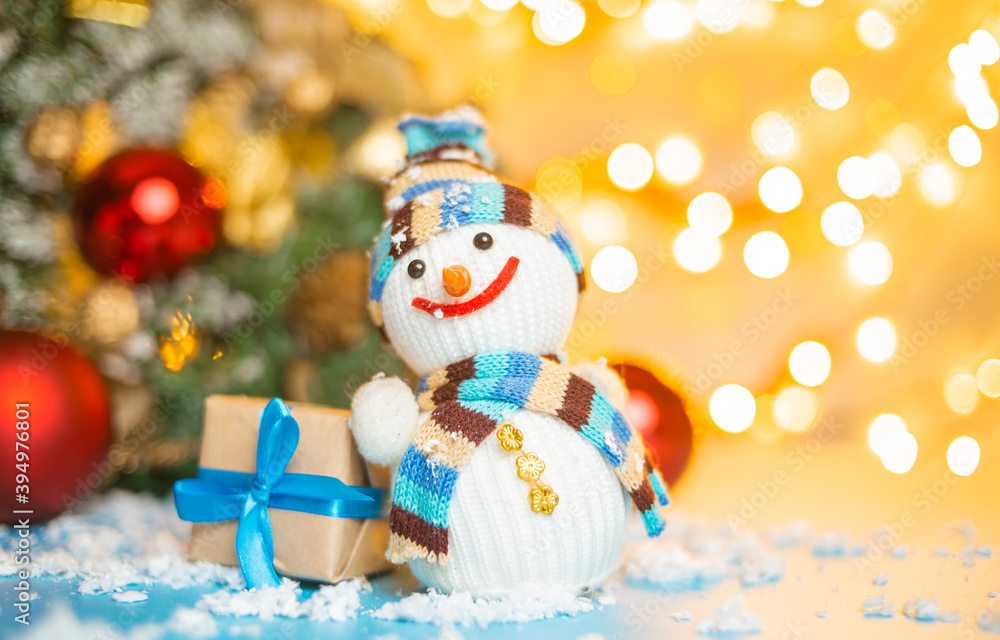 Snowman and Christmas gifts on bright yellow background