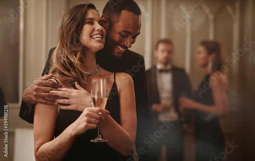 Loving couple having a great time at gala night photo
