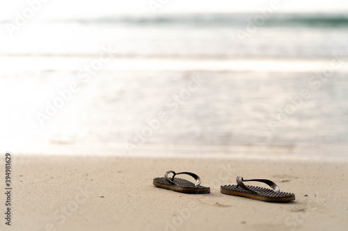 flip flops on the beach background.