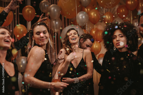  Group of friends having a great time at a party