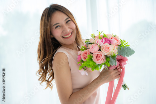 Young asian man asking women for wedding engagement with the ring, present and flower to be the husband and wife