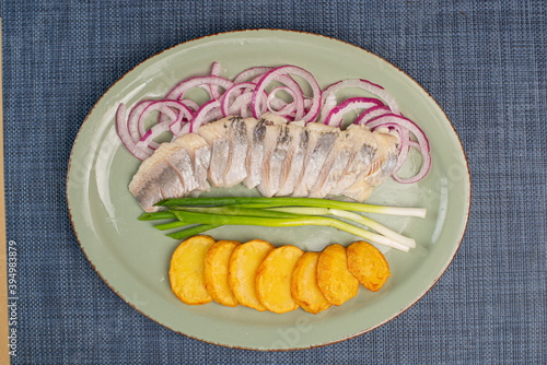 herring with cybul and potatoes photo