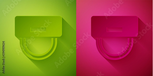 Paper cut Bellboy hat icon isolated on green and pink background. Hotel resort service symbol. Paper art style. Vector.