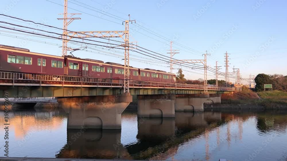 Hankyu train crossing a bridge over a river in Osaka, Japan. Hankyu train crossing a bridge over a river in Osaka, Japan.