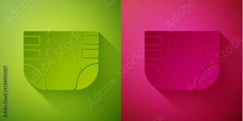 Paper cut Adult diaper icon isolated on green and pink background. Paper art style. Vector.