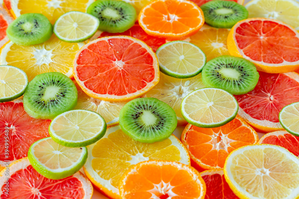 Assorty of sliced citrus fruits. Can be used as background Assorty of sliced citrus fruits. Can be used as background
