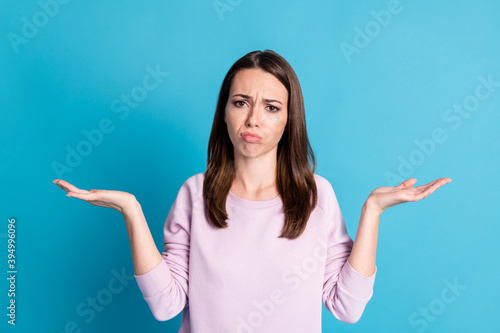 Photo of sad depressed displeased lady can't fly plane have phobia shrug shoulders crying desperate can't visit family wear casual purple sweatshirt isolated blue color background © deagreez