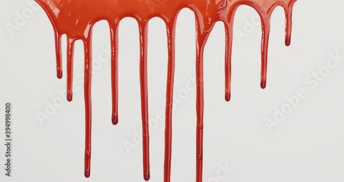 Red blood liquid dripping down on white background.