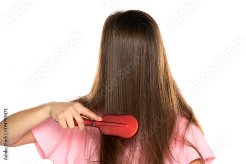 A woman combing the hair over her face