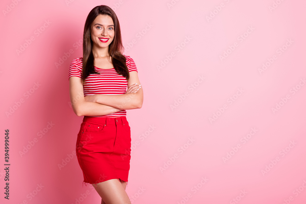 Portrait of good looking young person crossed arms toothy smile isolated on pastel pink color background