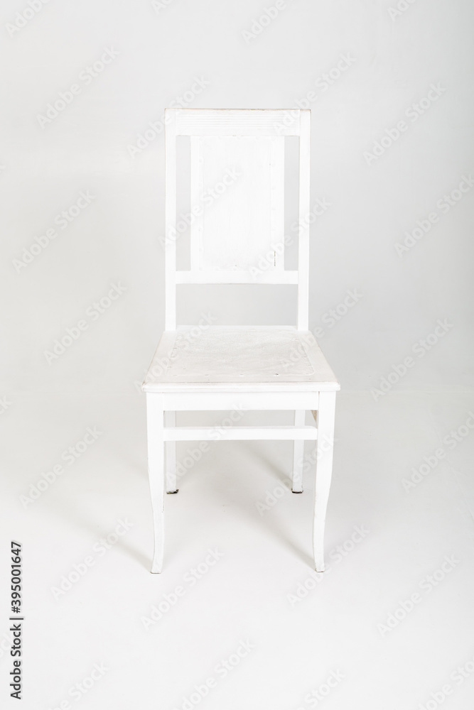 White wooden chair on a white background. White wooden chair on a white background.