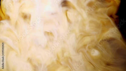 coffee with milk, abstract patterns are formed by mixing milk and coffee