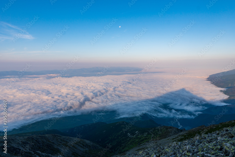 Mountains with Inversion at sunrise as seen From Krivan Peak in High Tatras, Slovakia