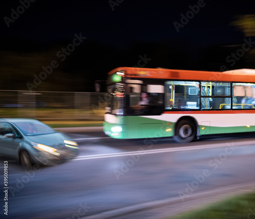 Dangerous city traffic situation between a bus and a car in motion blur