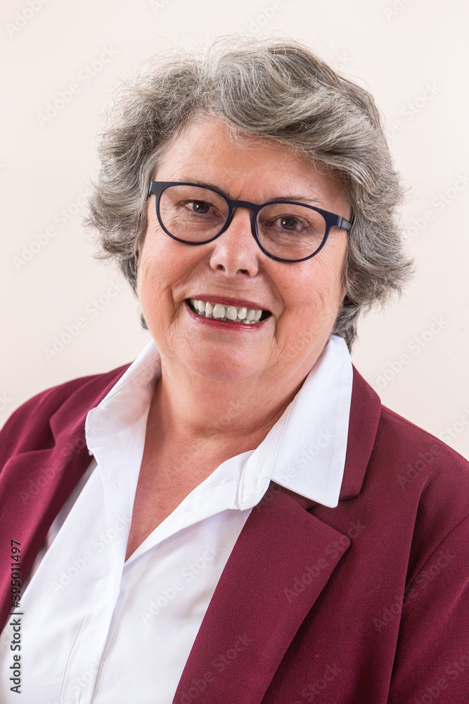 Closeup portrait of happy business senior lady, smiling, looking at camera. Closeup portrait of happy business senior lady, smiling, looking at camera.