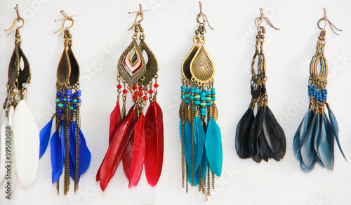 Wallpaper Mural Moscow, Russia, June 26, 2020. Decorative women's jewelry earrings with colorful feathers Torontodigital.ca