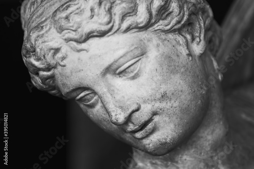 Close up face of Olympic goddess of love and beauty Aphrodite (Venus). Fragment of ancient statue. © zwiebackesser