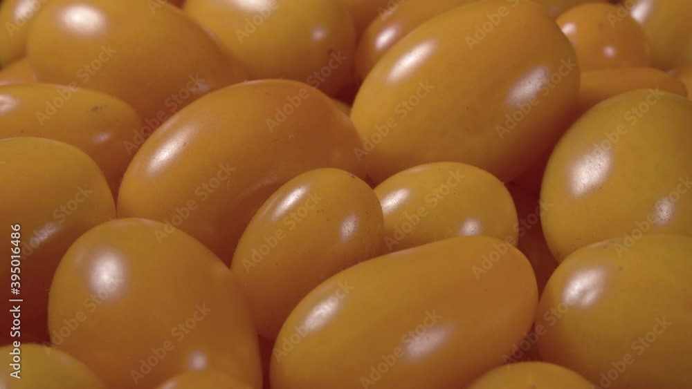 Cherry yellow tomatoes close up. Ripe vegetables. Miniature vegetable. Cherry yellow tomatoes close up. Ripe vegetables. Miniature vegetable.