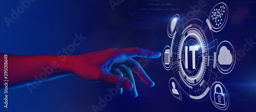Hand touching IT-button inscription, information technology (IT) and digital transformation concept