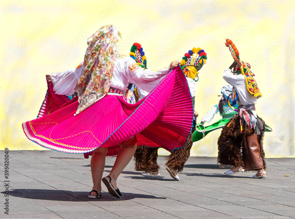 Ecuador, Sunday dancers in traditional costumes are dancing in the center of Quito. 