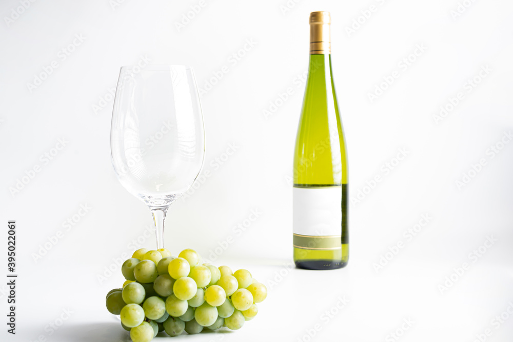 Wine bottle and two wine glasses. Wine bottle against a white background