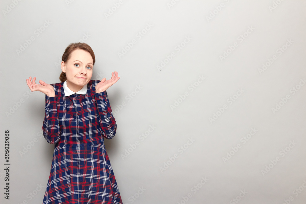 Portrait of funny confused perplexed girl making silly goofy face Portrait of funny confused perplexed girl making silly goofy face