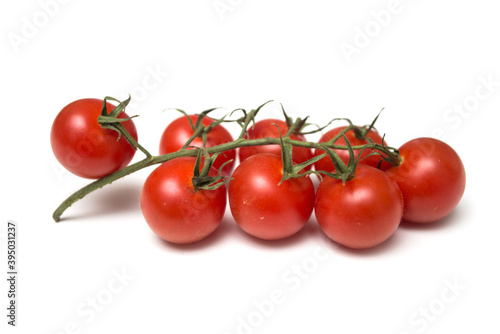 Closeup of organic cherry tomatoes on white background