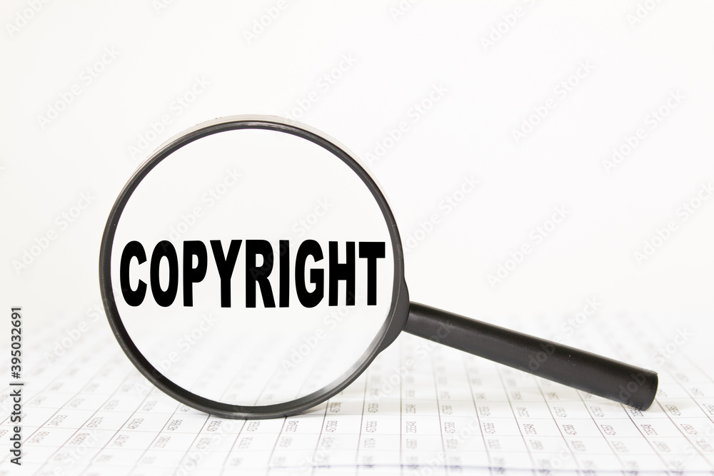 words COPYRIGHT in a magnifying glass on a white background. business concept words COPYRIGHT in a magnifying glass on a white background. business concept