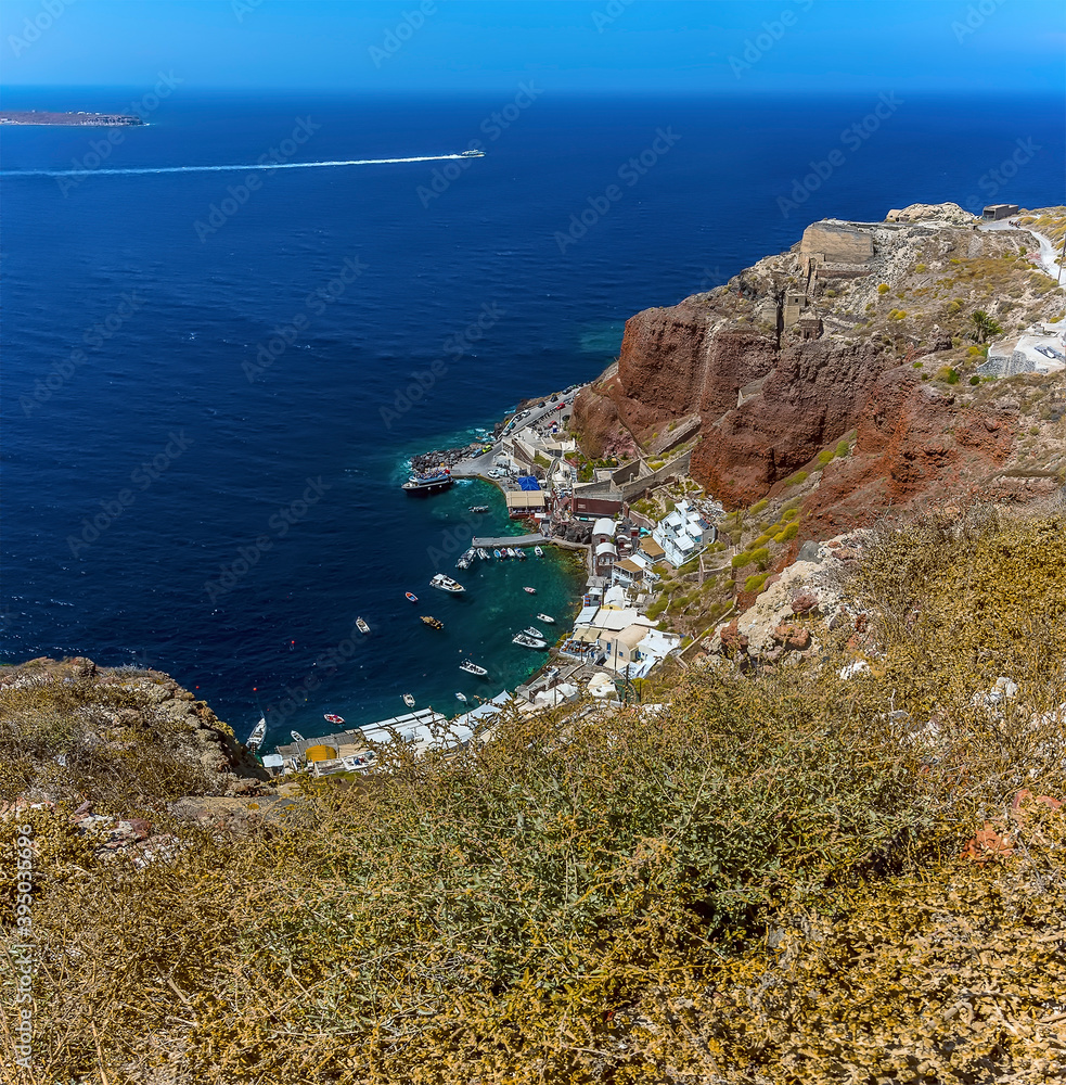 A view from Oia castle over Amoudi Bay at the northern tip of Santorini in summertime