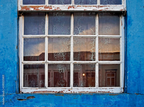 Colonial window reflecting the sunset  Sao Joao del Rei  Brazil