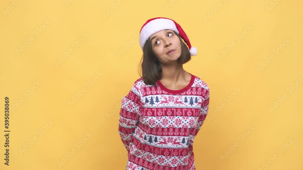 Young latin woman celebrating christmas day dreaming of achieving goals and purposes Young latin woman celebrating christmas day dreaming of achieving goals and purposes