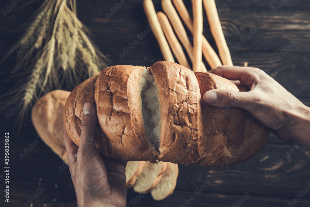 Fresh bread in male hands