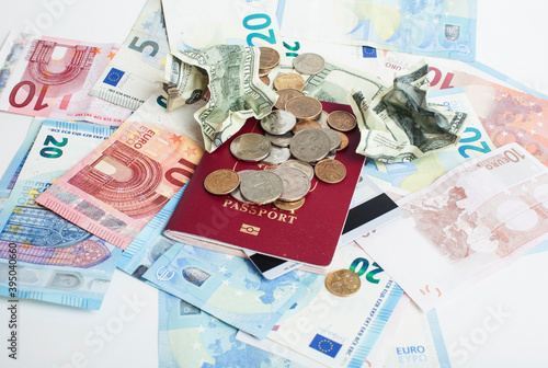 Cash on table isolated: dollars, euro, rubl broken money. All in mess, global crisis . passport travel concept