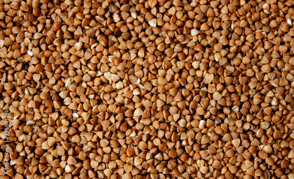 Buckwheat, buckwheat background, buckwheat texture, loose buckwheat. Mockup Buckwheat, buckwheat background, buckwheat texture, loose buckwheat. Mockup