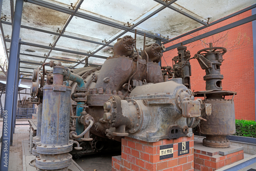 The rusty turbine generator lay idle in a corner of the factory
