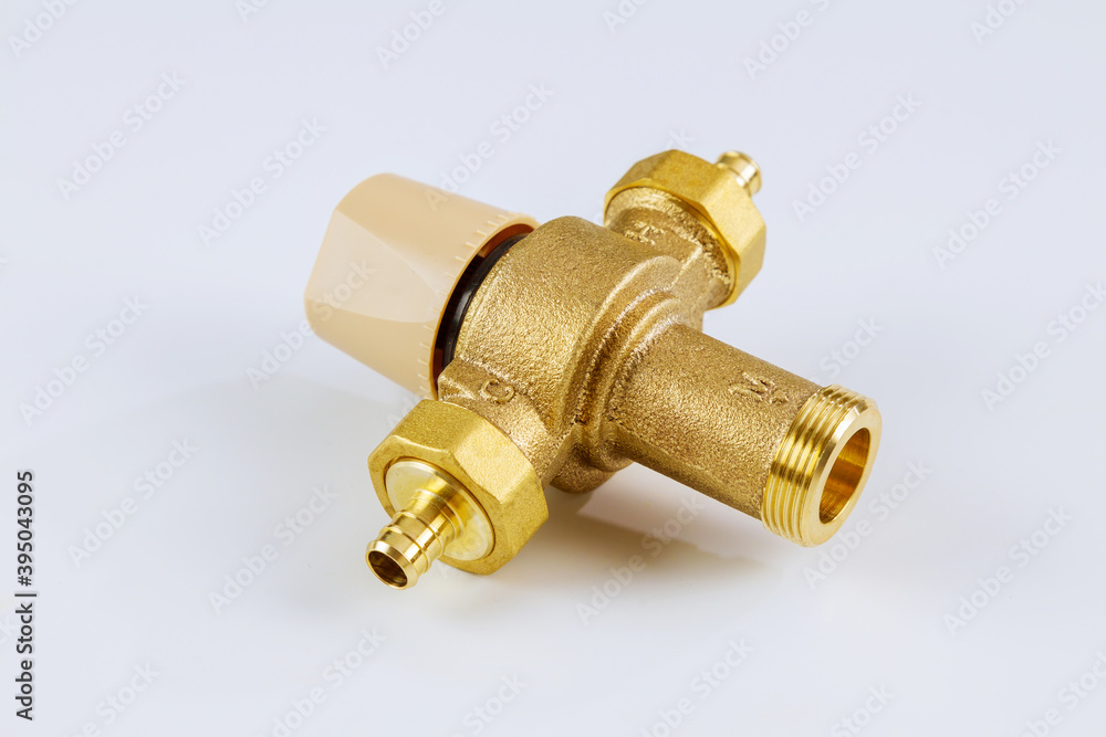 Supply plumbing water various brass thermostatic mixing valve on isolated white background. Supply plumbing water various brass thermostatic mixing valve on isolated white background.