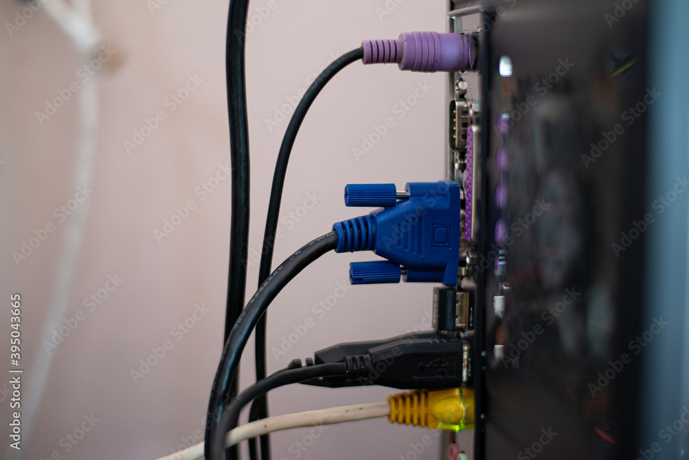 Cables plugged into the back of the computer. Cables plugged into the back of the computer.