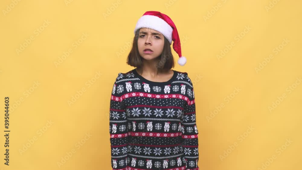 Young latin woman celebrating christmas day screaming very angry and aggressive Young latin woman celebrating christmas day screaming very angry and aggressive