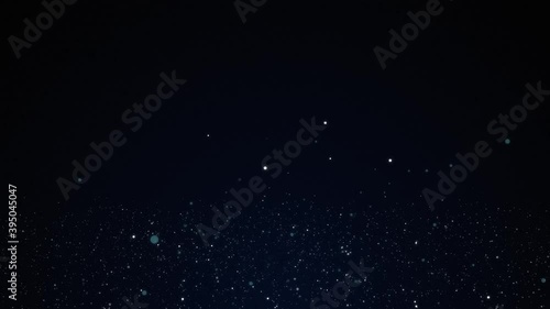Floating dust particles shimmering on a blue background, bokeh abstract background
