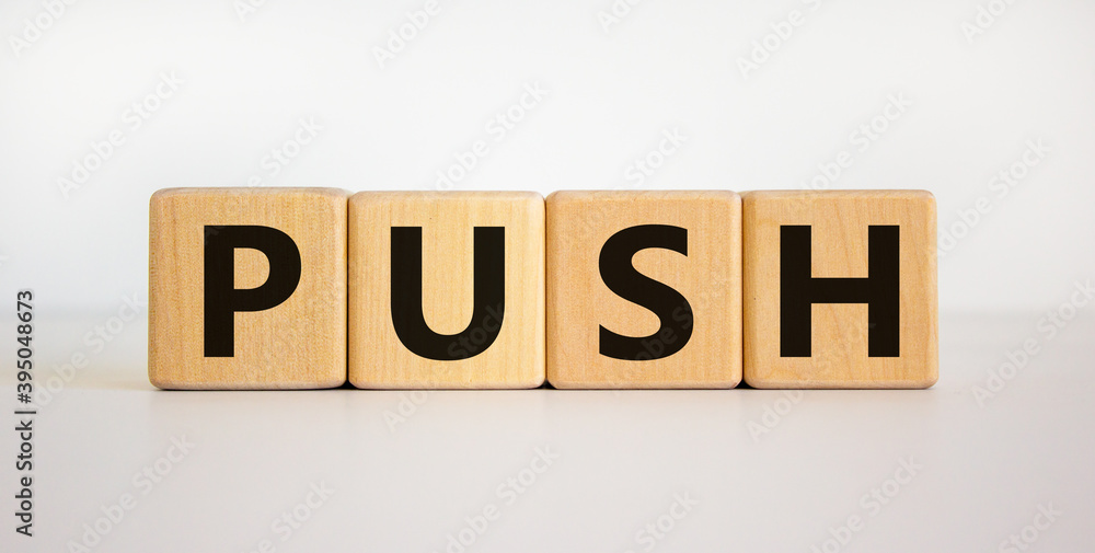 Time to push. Wooden block form the word 'push' on beautiful white background. Business and push concept. Copy space. Time to push. Wooden block form the word 'push' on beautiful white background. Business and push concept. Copy space.