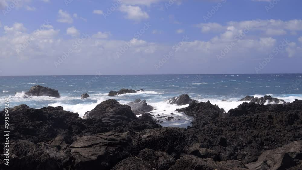 Waves crashing down Le Gouffre, a long natural rocky corridor on Reunion Island Waves crashing down Le Gouffre, a long natural rocky corridor on Reunion Island