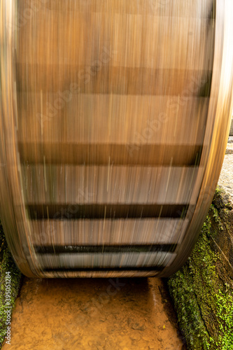 Spinning flour mill water wheel  photo