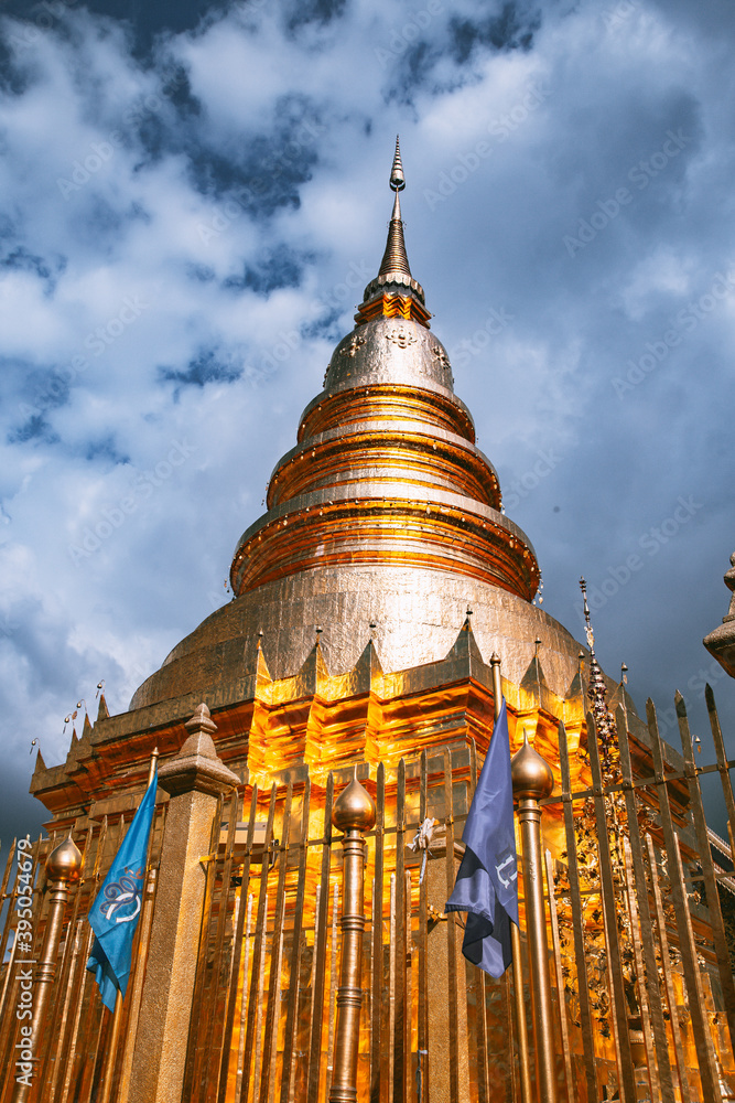 Naklejka premium Wat Phrathat Haripunchai Woramahawihan during Loy Khratong lantern festival in Lamphun, Chiang Mai, Thailand